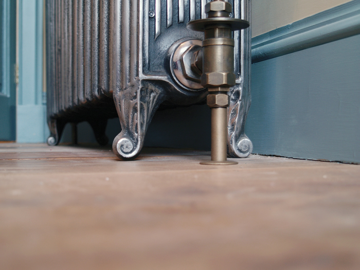 Churchill hand burnished cast iron radiator leg detail with manual radiator valve